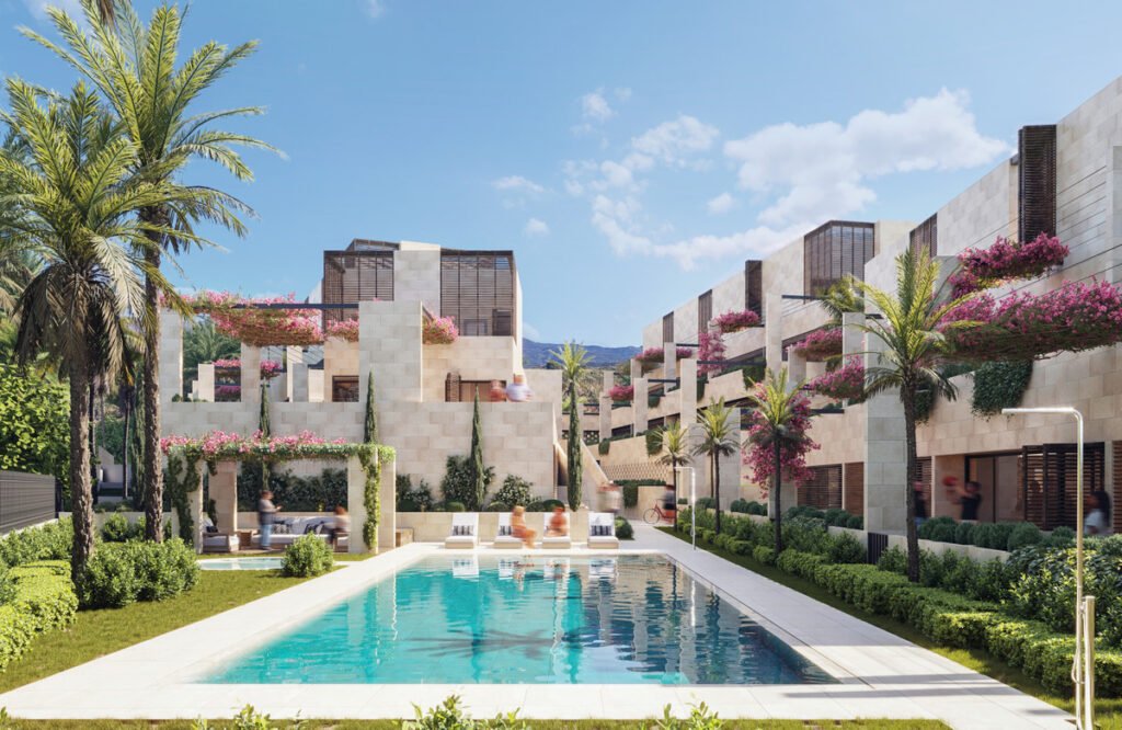 Luxury new development in Marbella with modern homes, landscaped gardens, palm trees and communal swimming pool